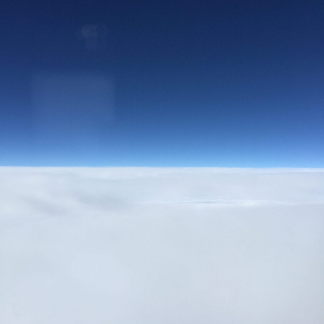 sky and clouds from a plane window